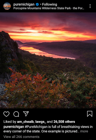 A piece of social media coverage about the Pure Michigan campaign. There is an image of a sunset and mountains.